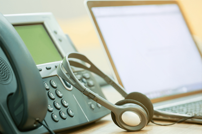 RITS telephone with headphones and computer